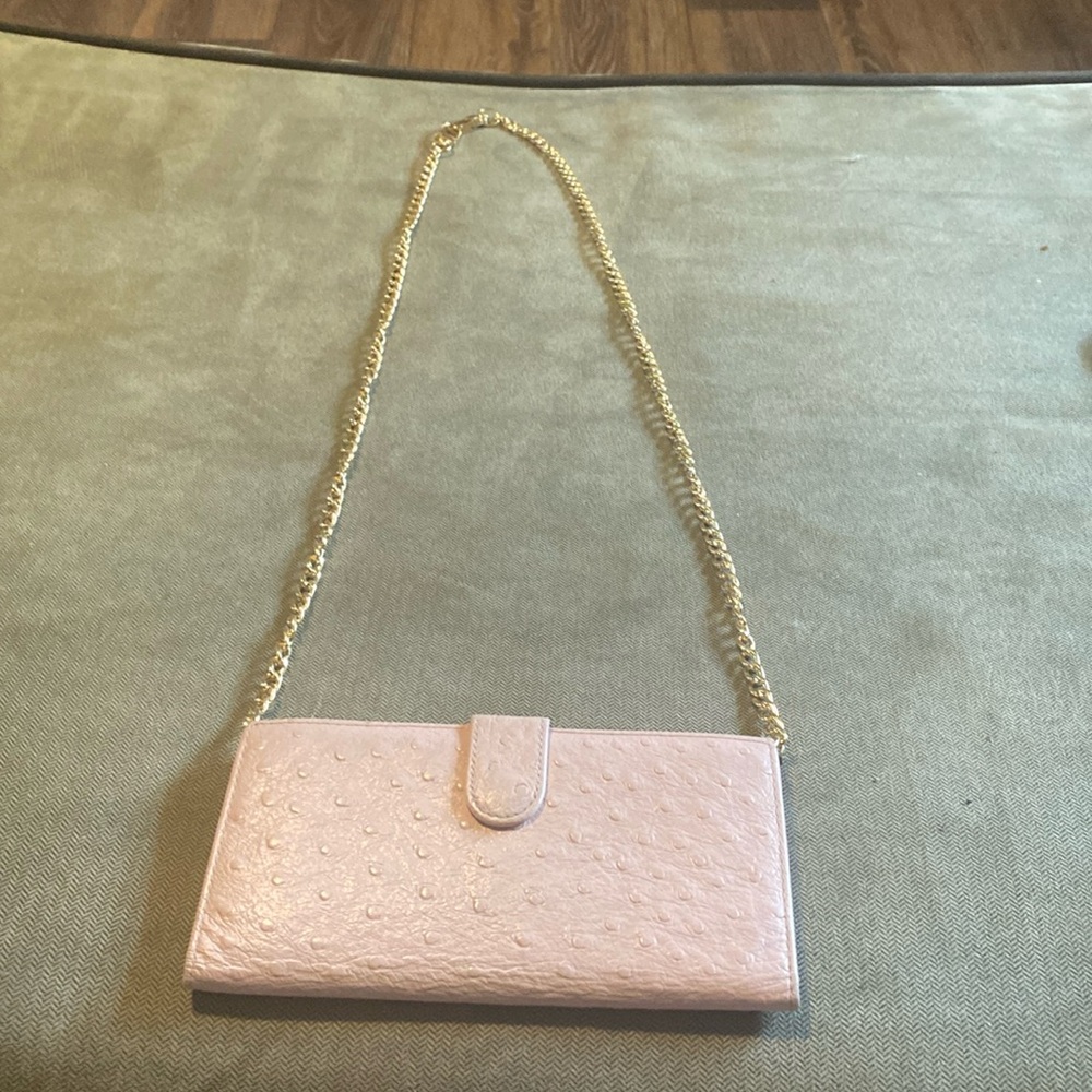 Wallet is great condition can put chain on to make crossbody